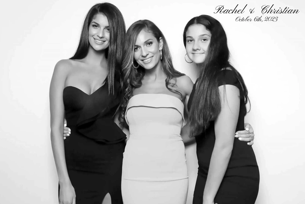 Group of women posing for a glam photobooth at a Event: glam photo booth rental in Burlington