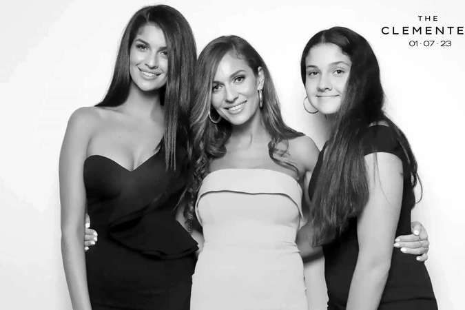 Women posing for a wedding photo booth picture: wedding photo booth rental in Hamilton