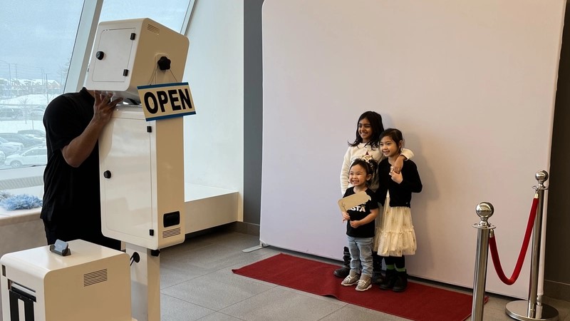 Instant Photo Booth being used: instant photo booth rental in Mississauga