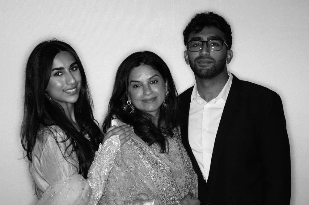 Black-and-white glam photo booth portrait of a family of three in formal wear: glam photo booth rental in Oakville