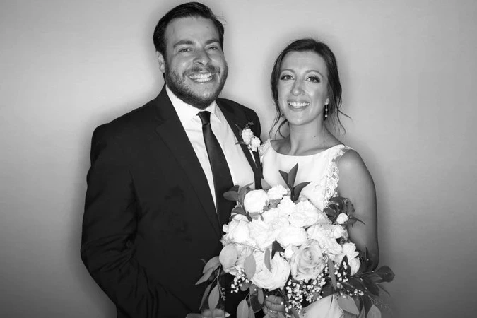 Couple posing at a wedding photo booth station: wedding photo booth rental in Vaughan