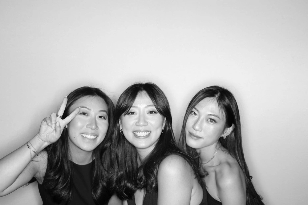 Group posing for a glam photo booth