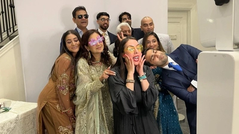 Group taking a picture with an Instant Photo Booth